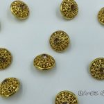 gold button with gold crystal