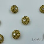 gold button with silver crystal