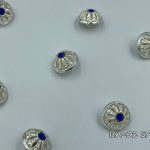silver button with blue crystal