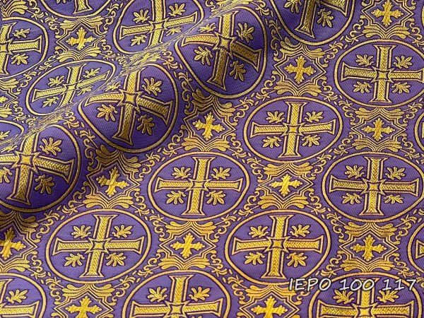 Fabric in light purple base with gold crosses in circles.